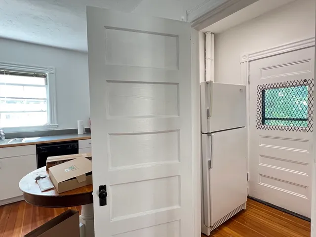 a bathroom with a bathtub and a window