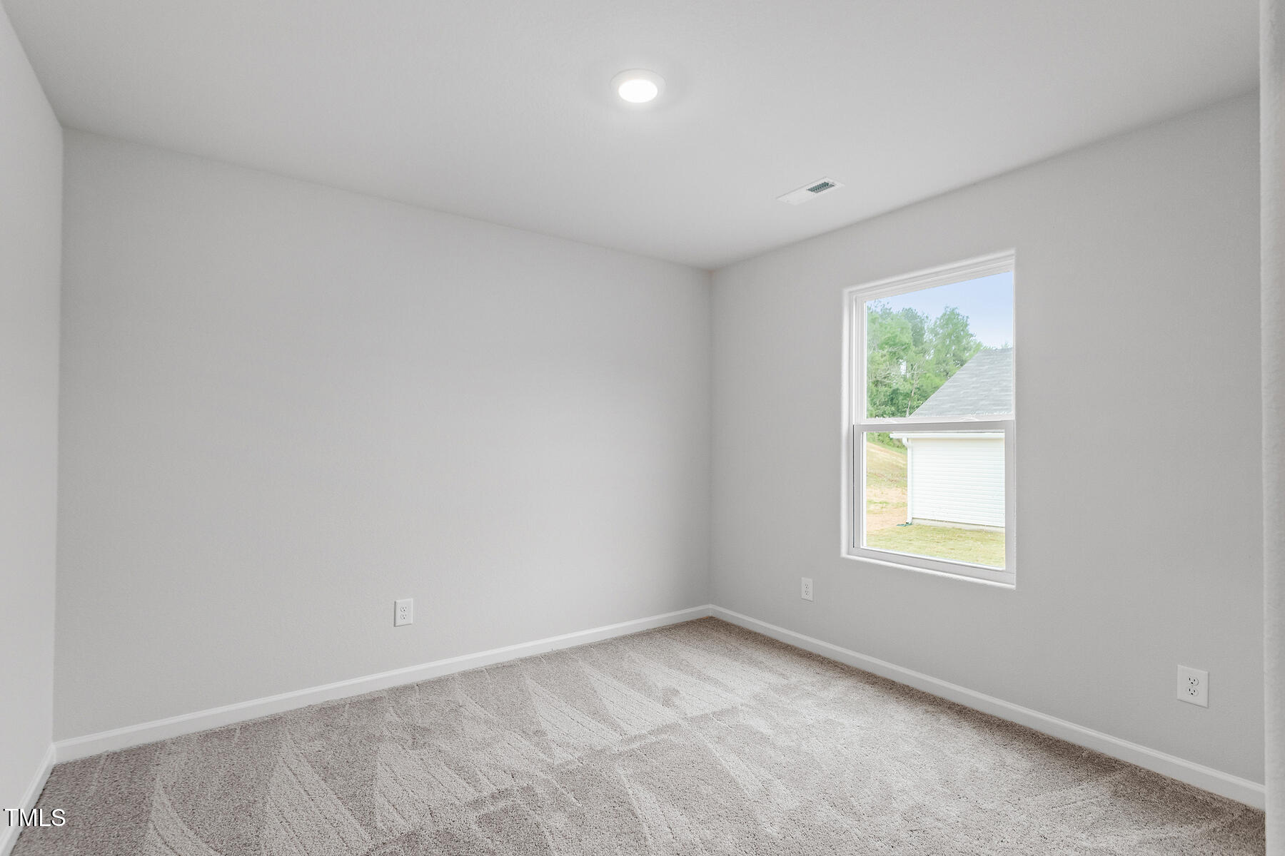 65 Crow Field Street Roxboro, NC 27574 - Photo 14 of 16 an empty room with a window