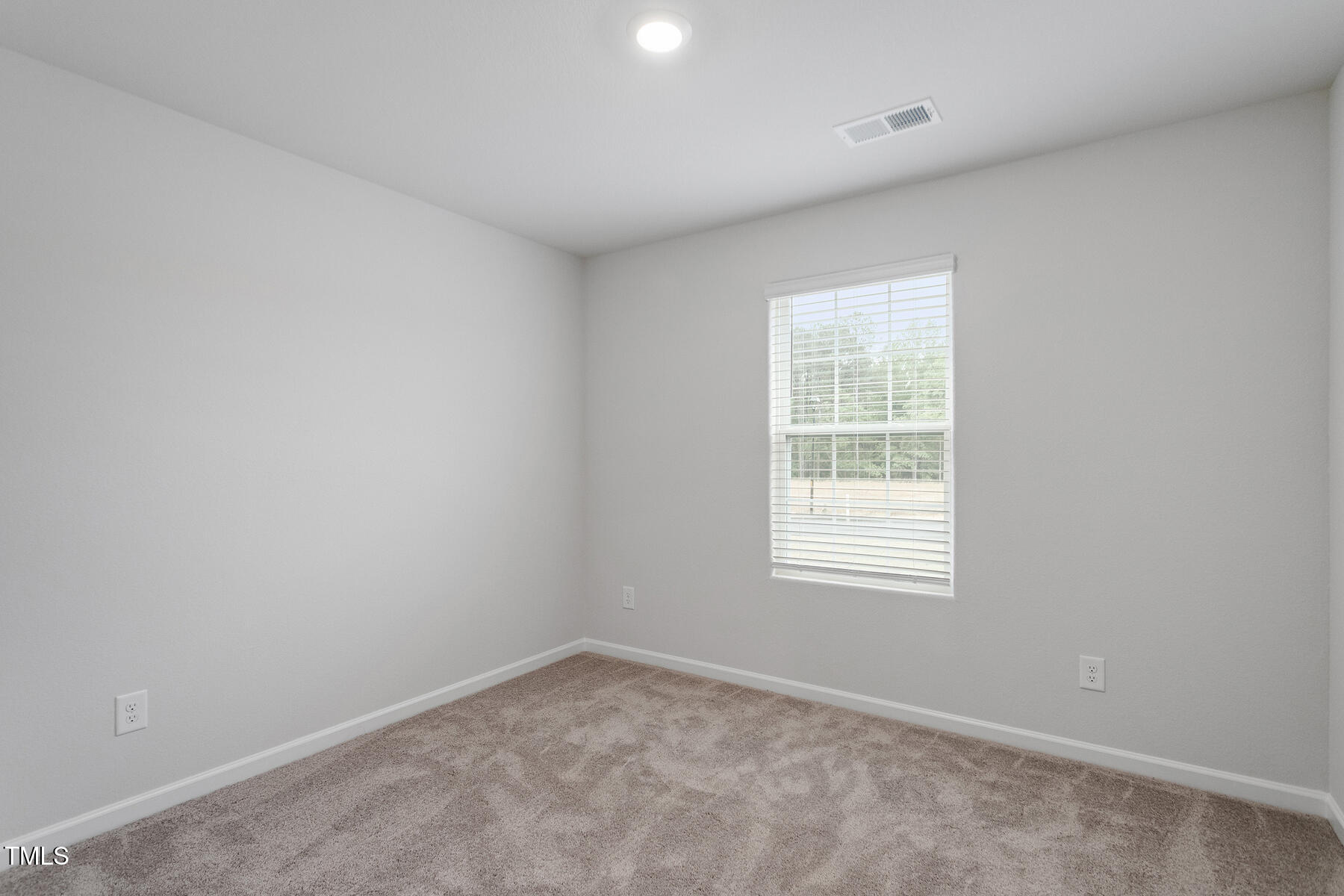 65 Crow Field Street Roxboro, NC 27574 - Photo 16 of 16 an empty room with a window