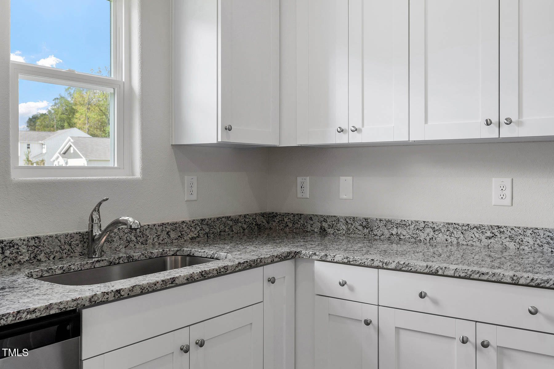 65 Crow Field Street Roxboro, NC 27574 - Photo 10 of 16 a kitchen with granite countertop white cabinets and a sink