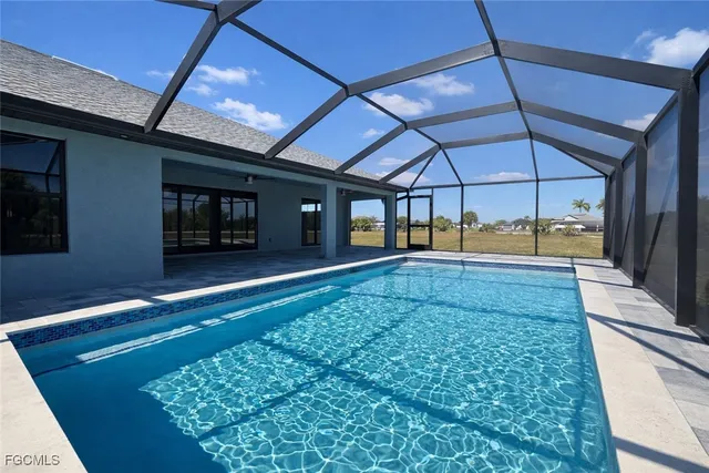 a view of a grassy field with trees