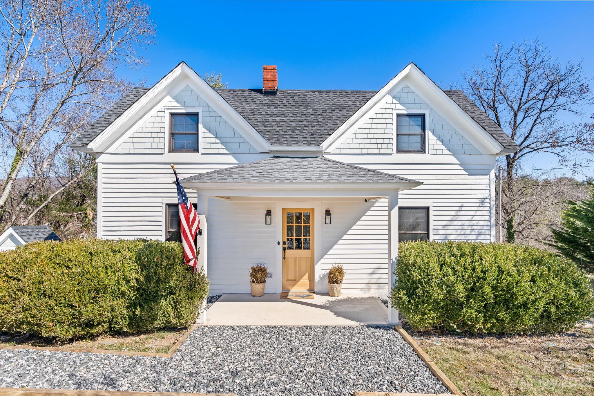 29 South School Road Marshall, NC 28753 - Photo 1 of 24 a view of a house with a small backyard