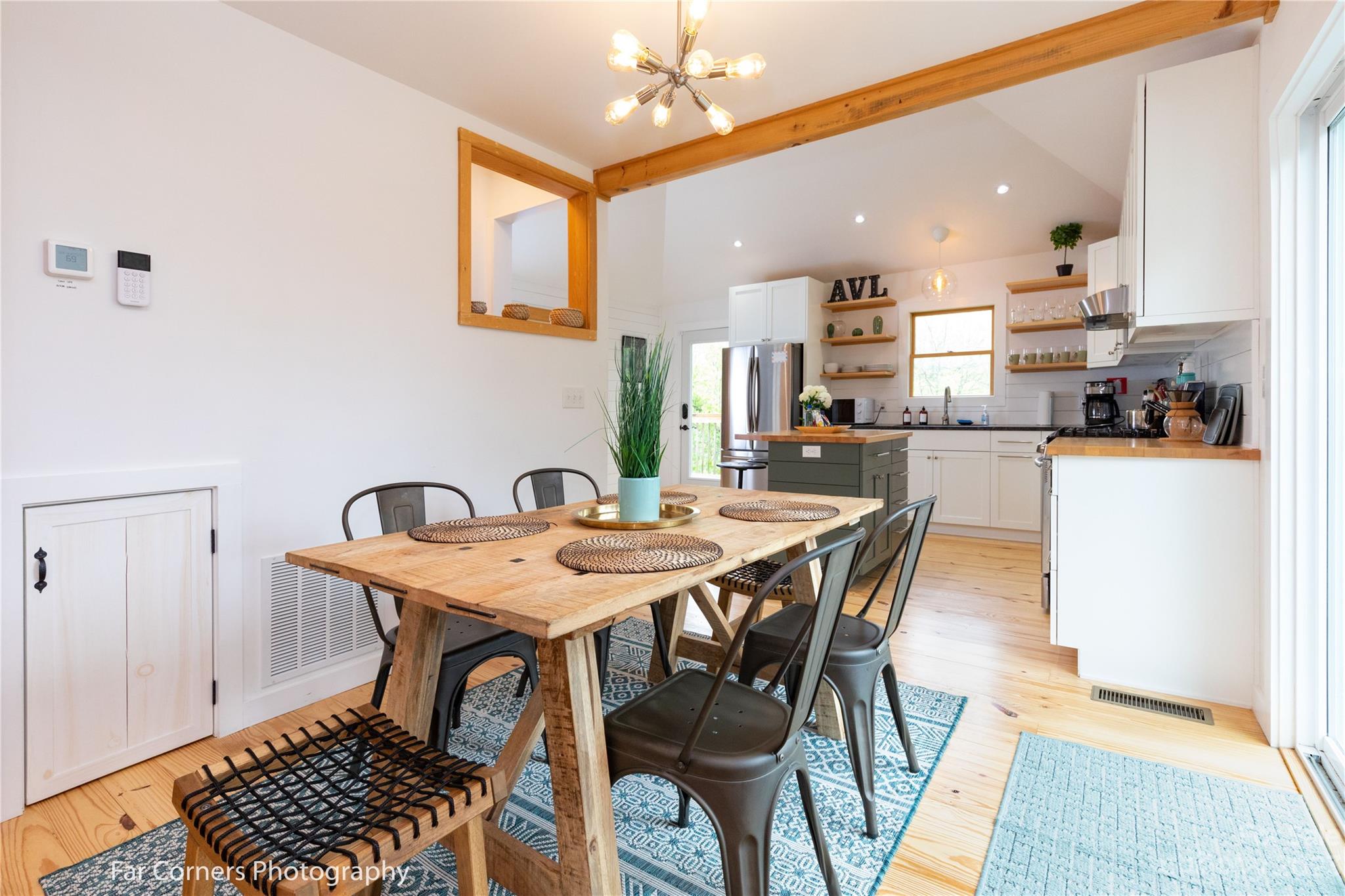 29 South School Road Marshall, NC 28753 - Photo 11 of 24 a view of a dining room with furniture and wooden floor