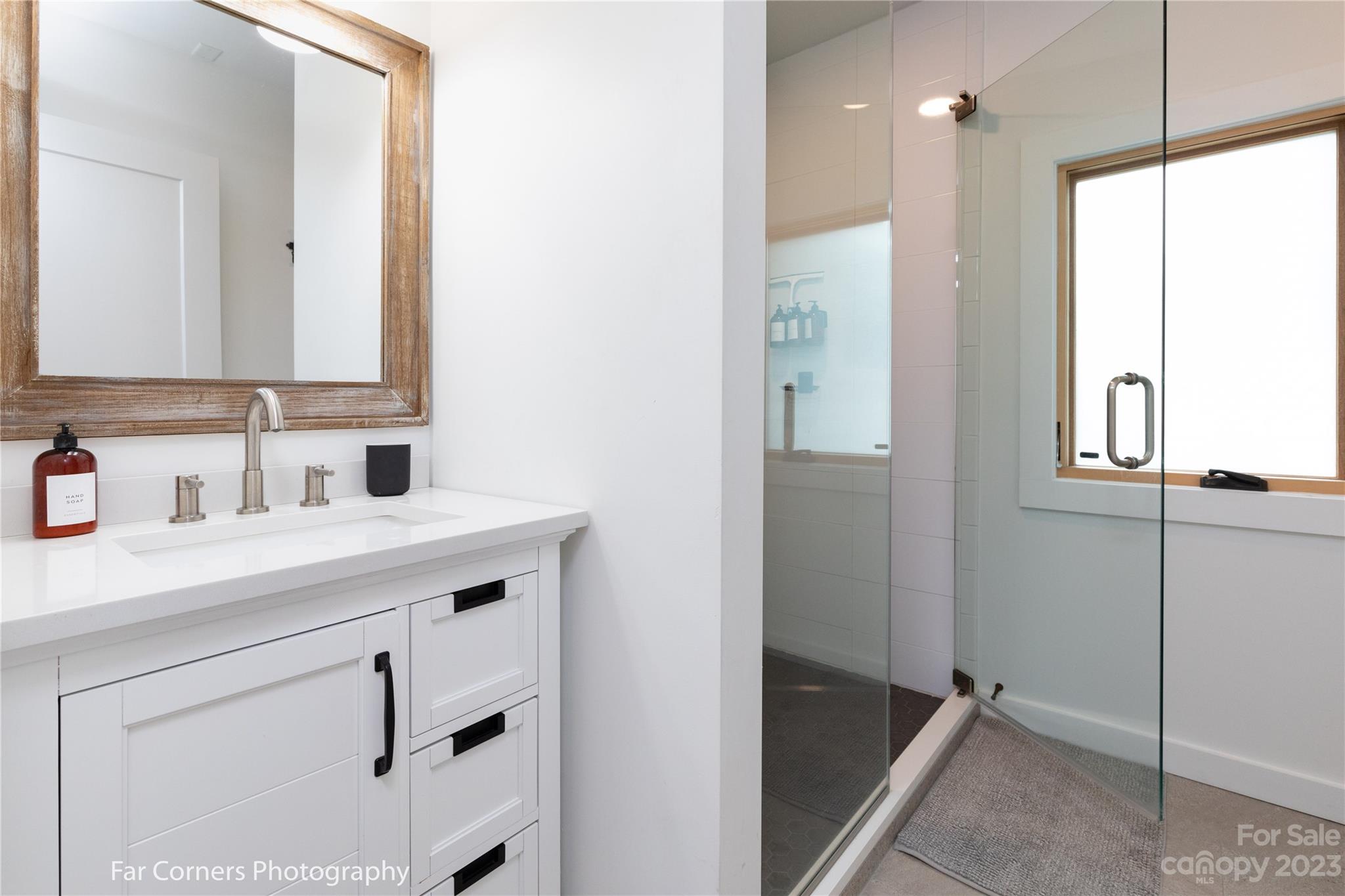 29 South School Road Marshall, NC 28753 - Photo 13 of 24 a bathroom with a sink and a mirror