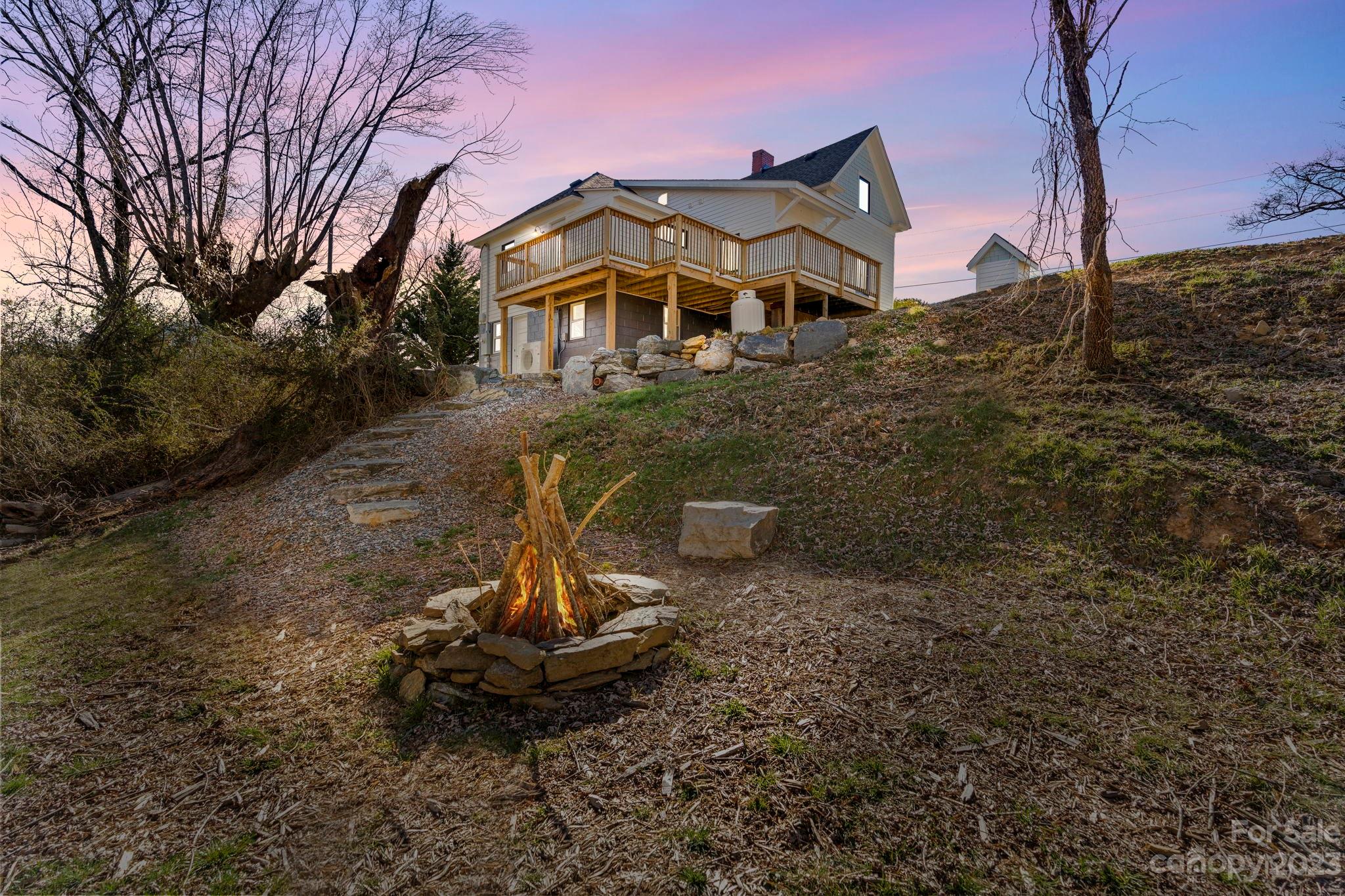 29 South School Road Marshall, NC 28753 - Photo 19 of 24 a front view of a house with a yard