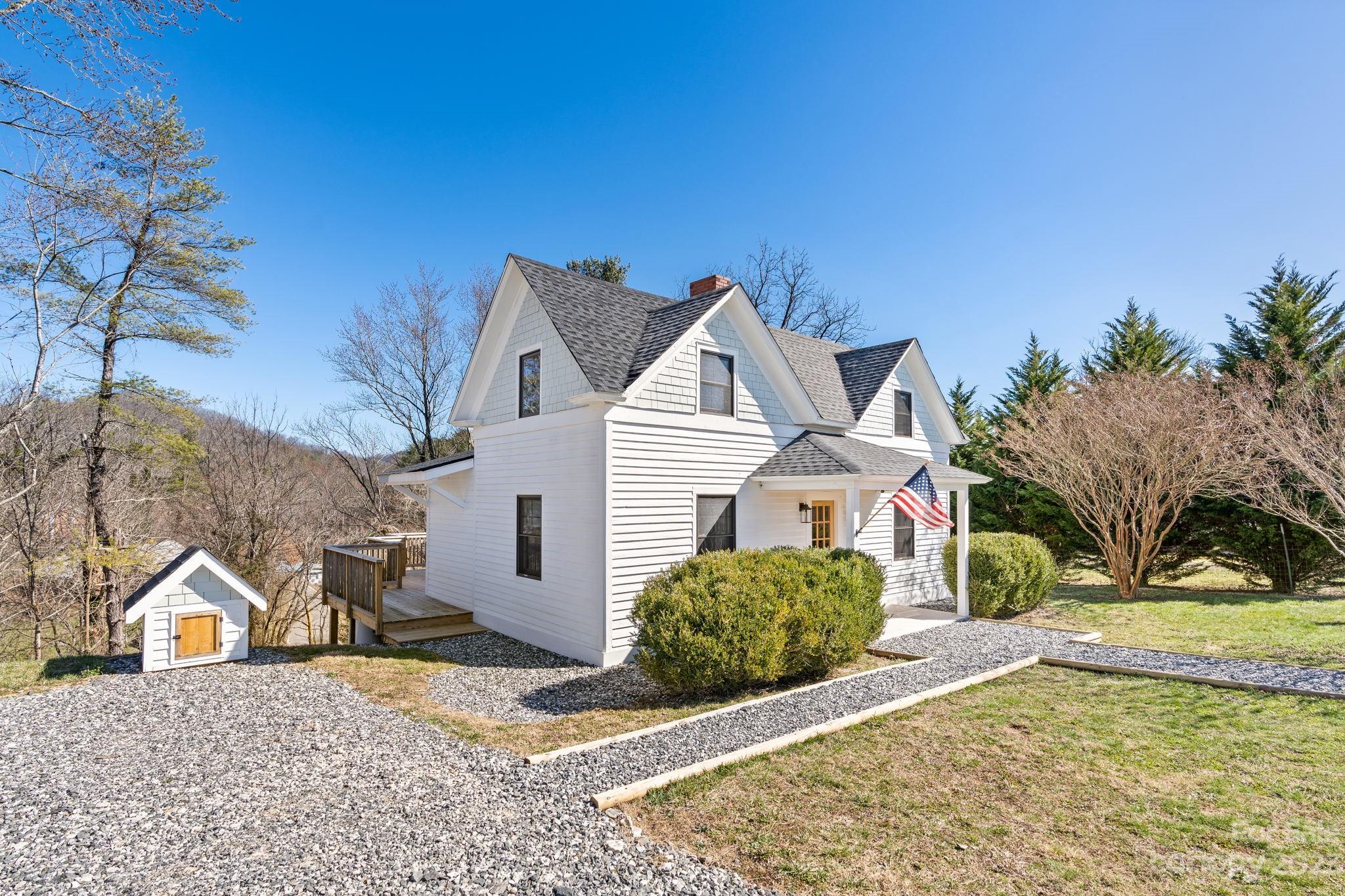 29 South School Road Marshall, NC 28753 - Photo 2 of 24 a view of a large house with a yard