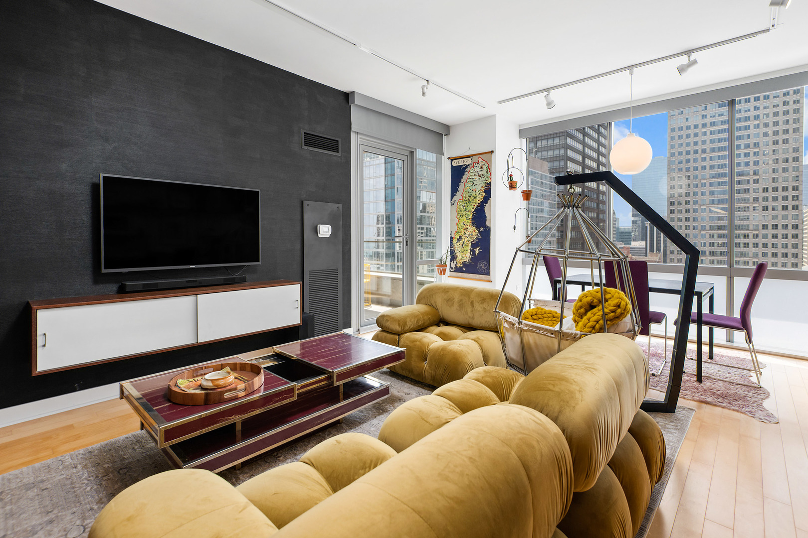 8 East Randolph Street, Unit 2906 Chicago, IL 60601 - Photo 3 of 13 a living room with furniture and a flat screen tv