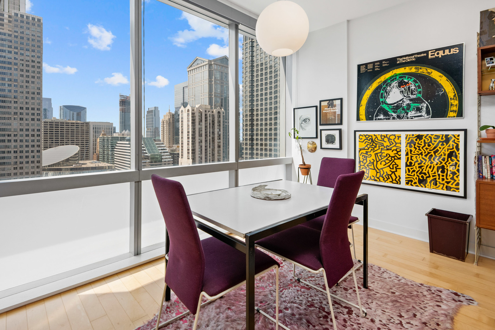 8 East Randolph Street, Unit 2906 Chicago, IL 60601 - Photo 7 of 13 a view of a dining room with furniture one side kitchen view and wooden floor