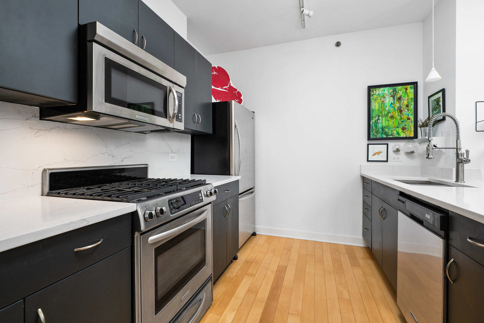 8 East Randolph Street, Unit 2906 Chicago, IL 60601 - Photo 9 of 13 a kitchen with a stove and a microwave
