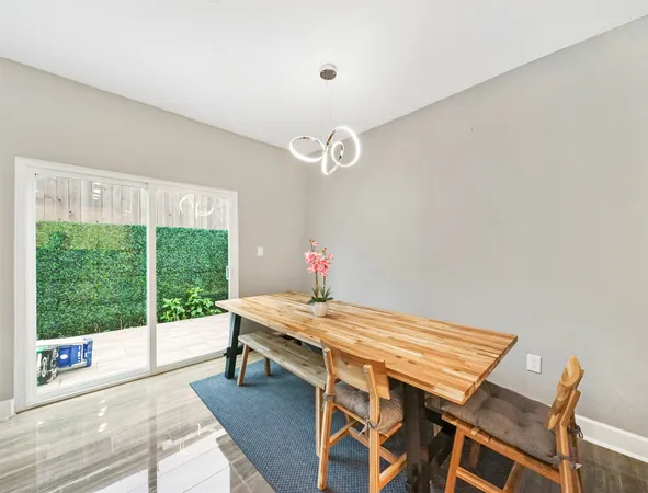 a dining room with a table and chairs