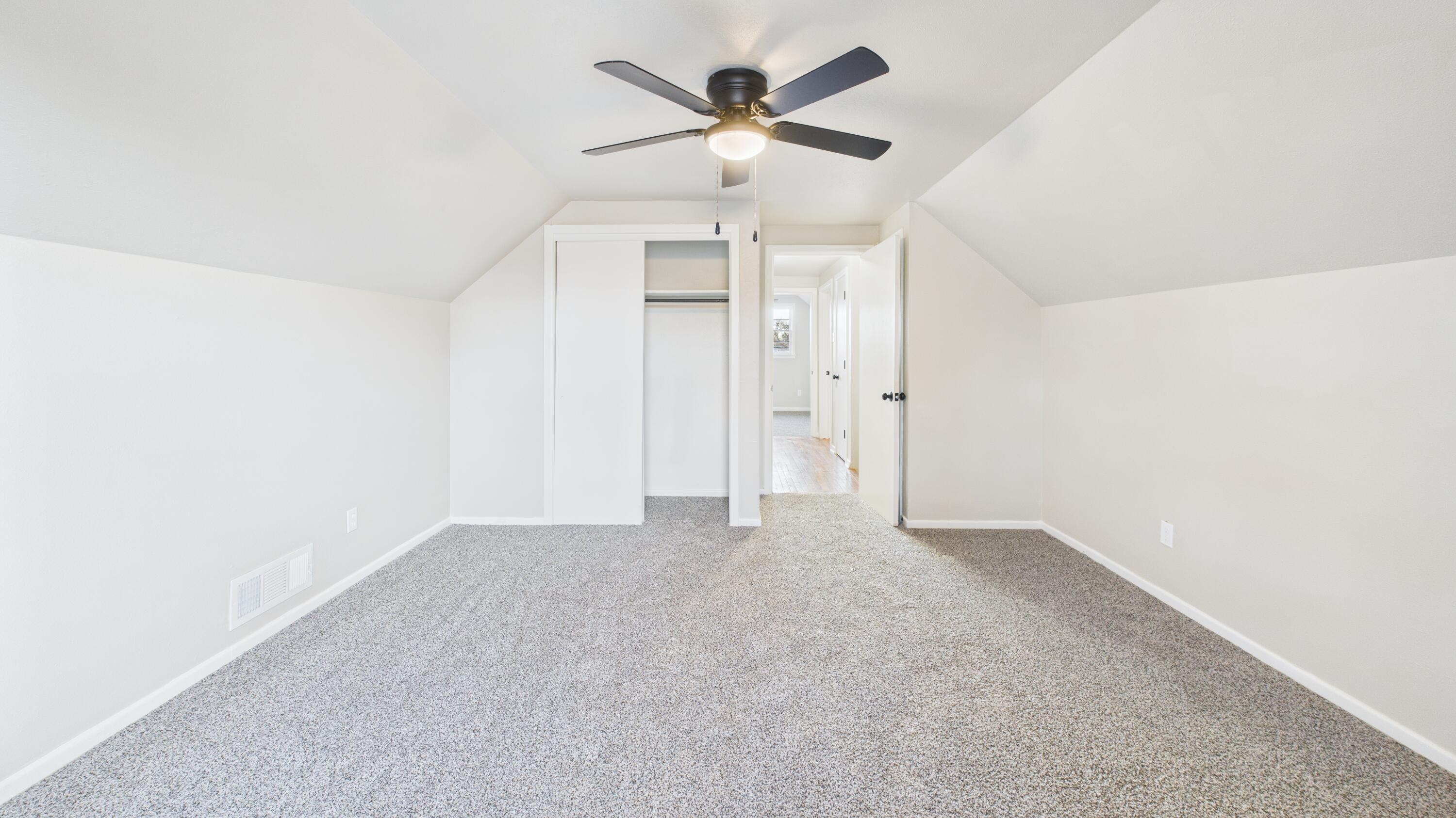 2013 69th Street Lubbock, TX 79412 - Photo 13 of 19 an empty room with fan and a ceiling fan