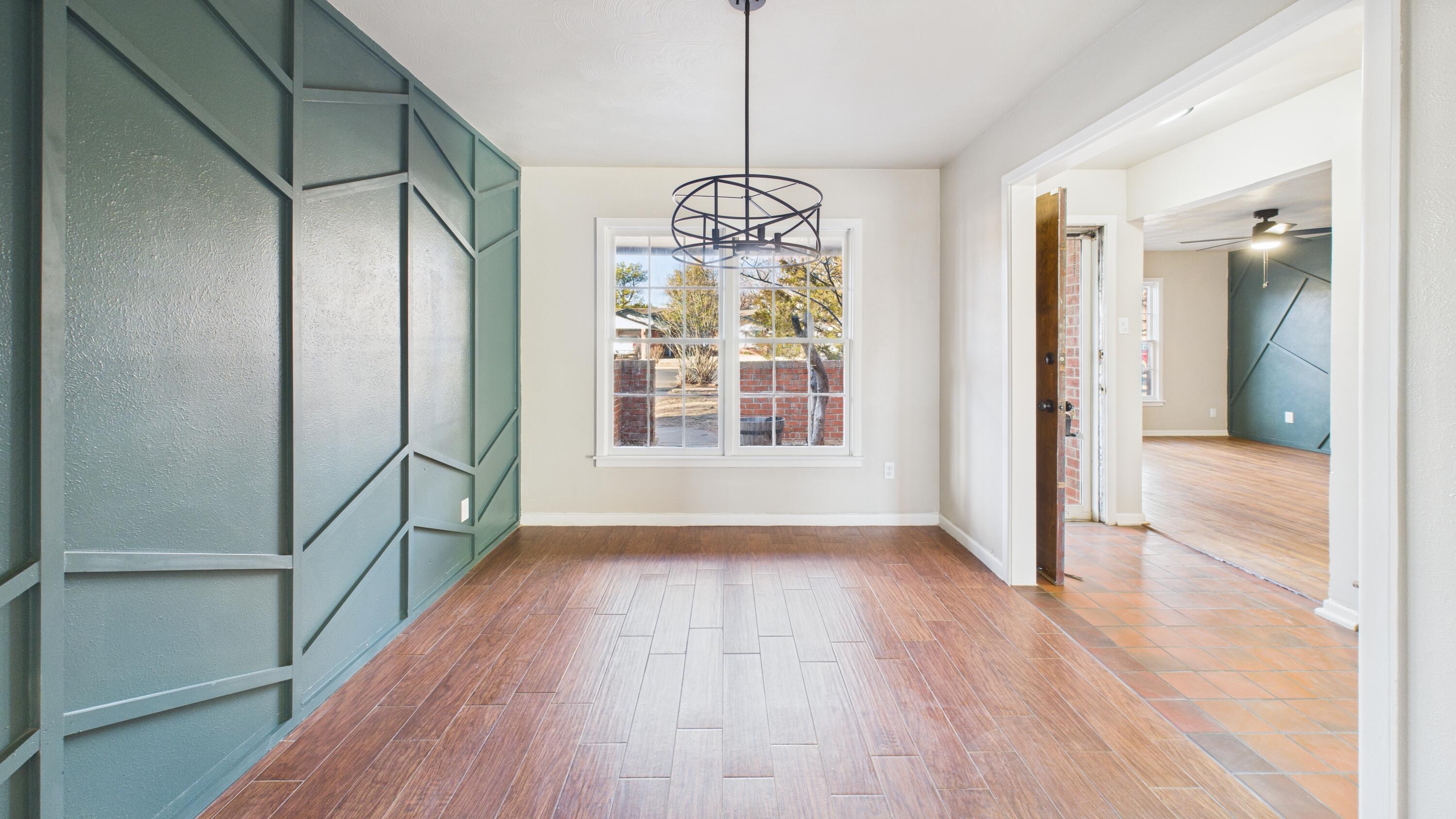 2013 69th Street Lubbock, TX 79412 - Photo 4 of 19 a view of livingroom with hardwood floor and window
