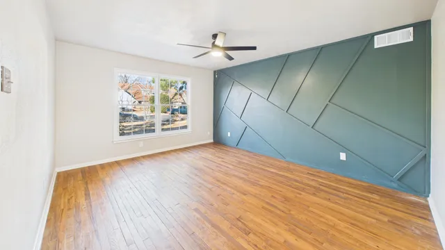 a view of an empty room and a window