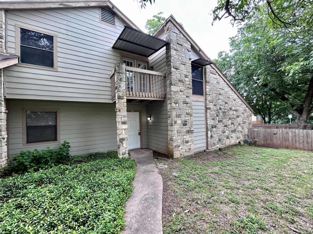 a view of a house with a yard and garage