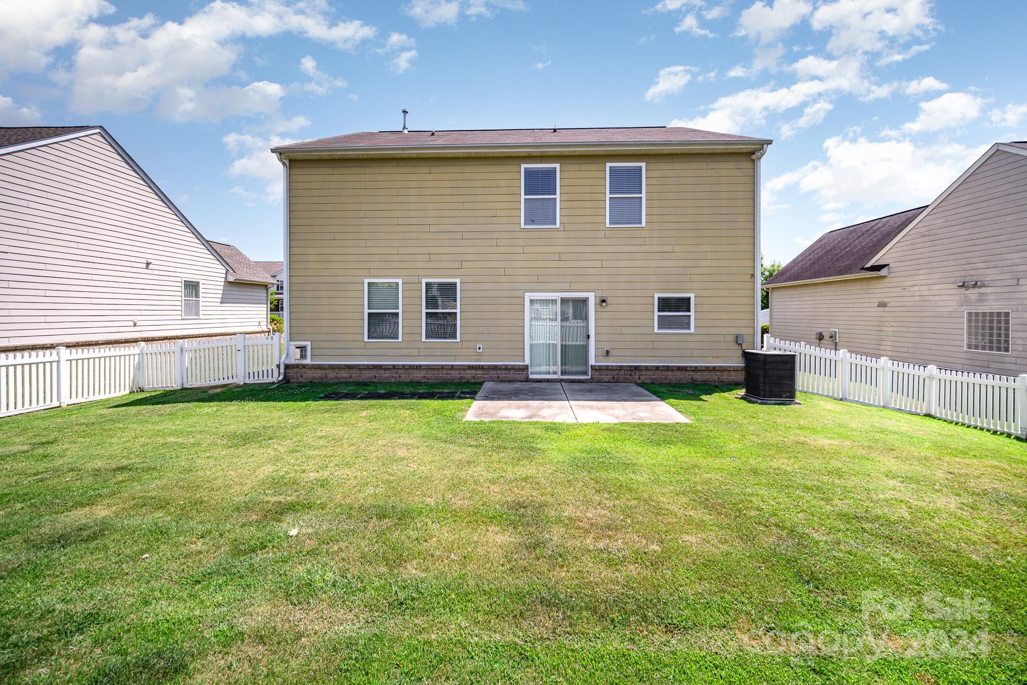 1007 Yellow Bee Road Indian Trail, NC 28079 - Photo 17 of 21 a front view of a house with a garden