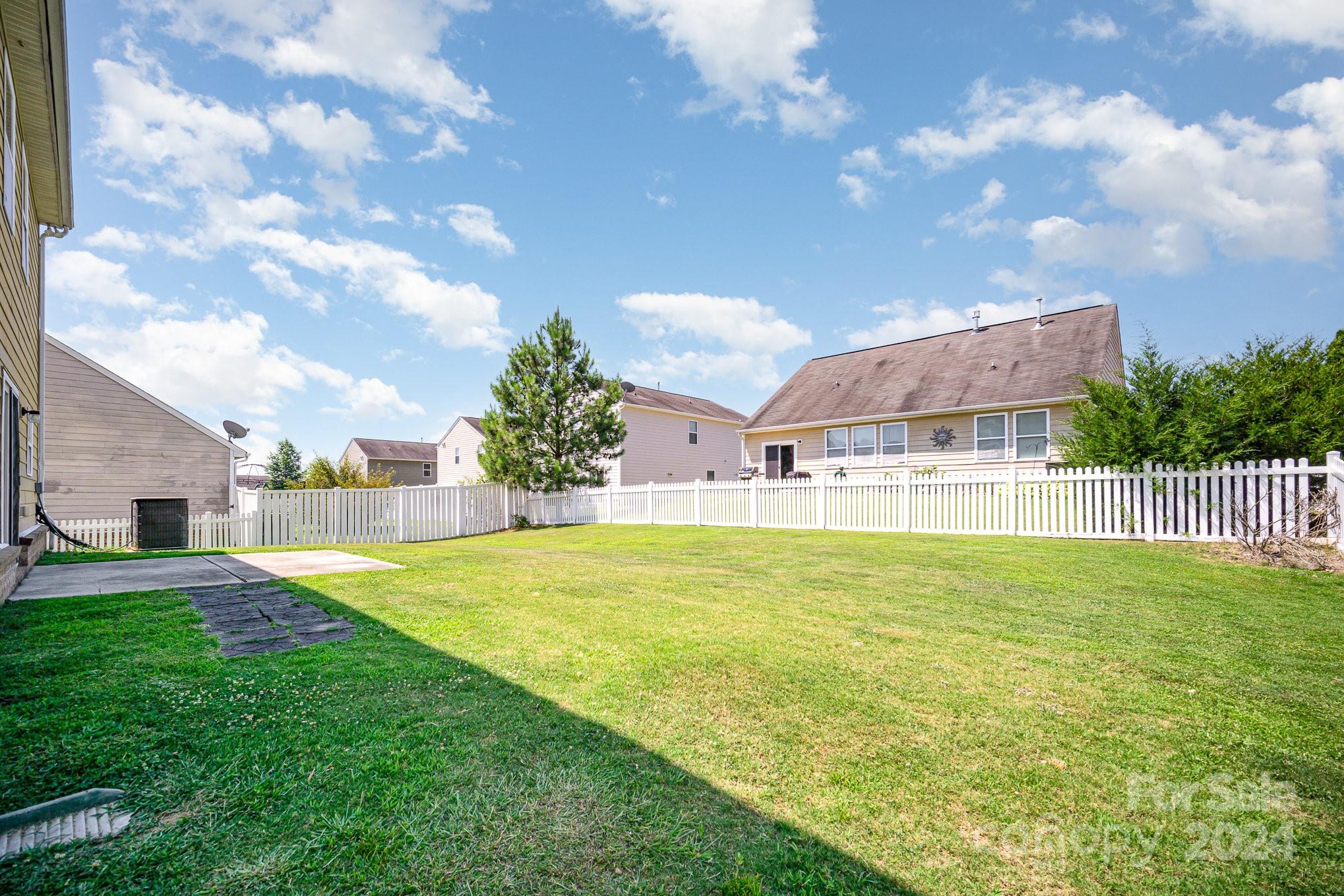 1007 Yellow Bee Road Indian Trail, NC 28079 - Photo 18 of 21 a view of an house with pool and a yard