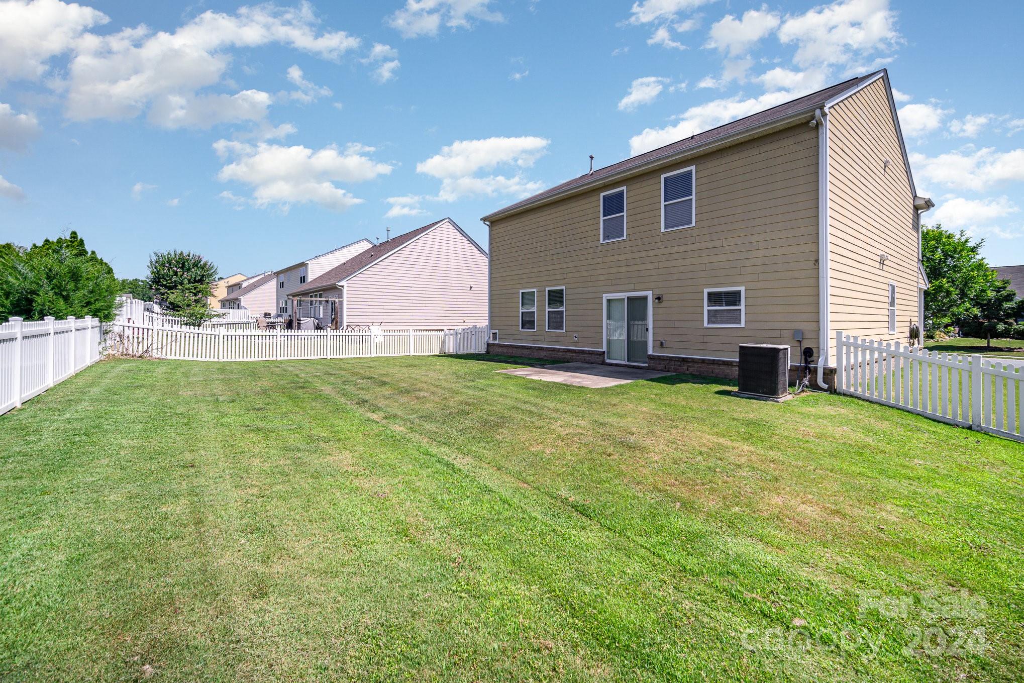 1007 Yellow Bee Road Indian Trail, NC 28079 - Photo 19 of 21 a view of a house with backyard and garden
