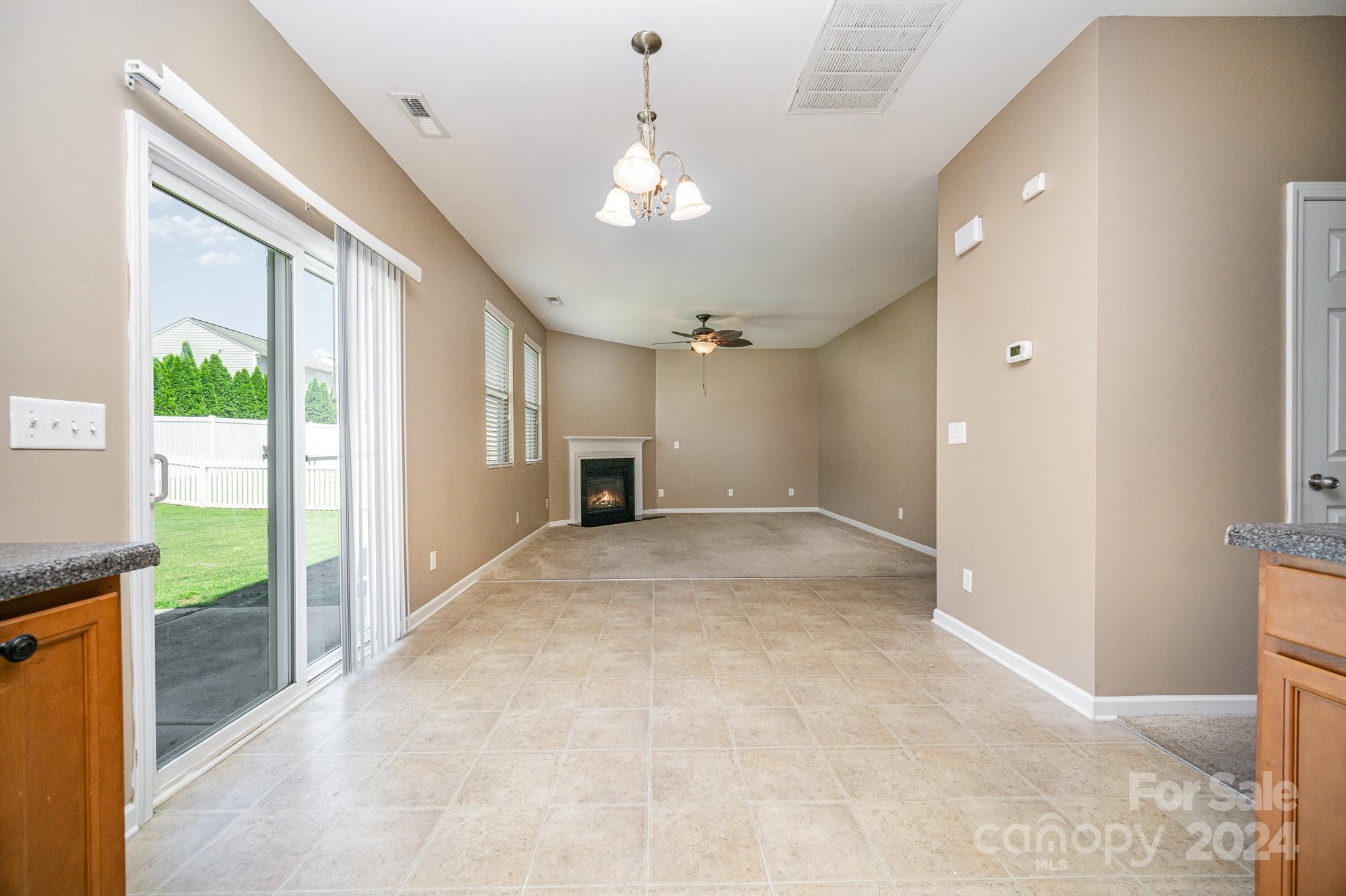 1007 Yellow Bee Road Indian Trail, NC 28079 - Photo 5 of 21 a view of a livingroom with a ceiling fan and window