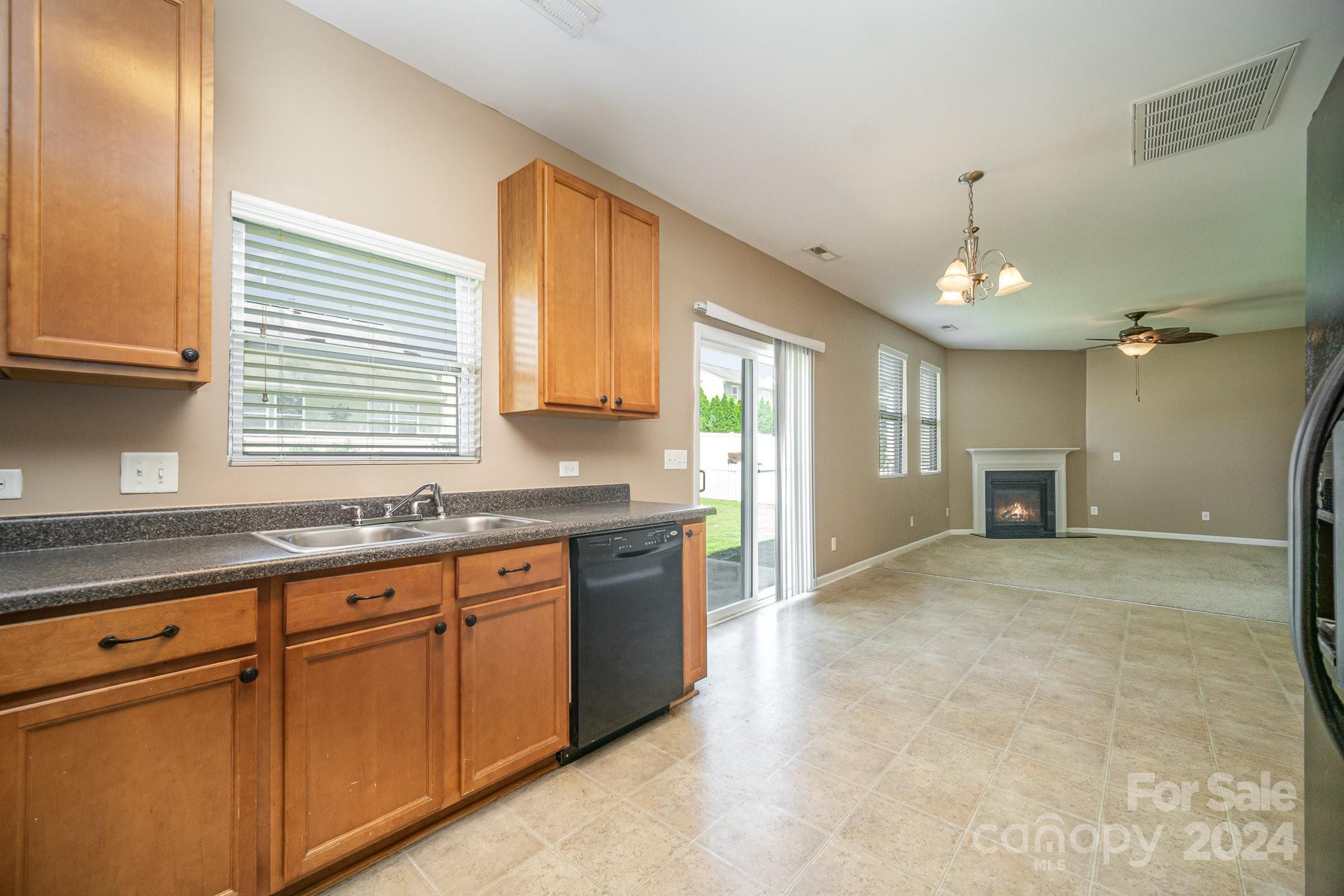 1007 Yellow Bee Road Indian Trail, NC 28079 - Photo 6 of 21 a kitchen with granite countertop a sink cabinets and window