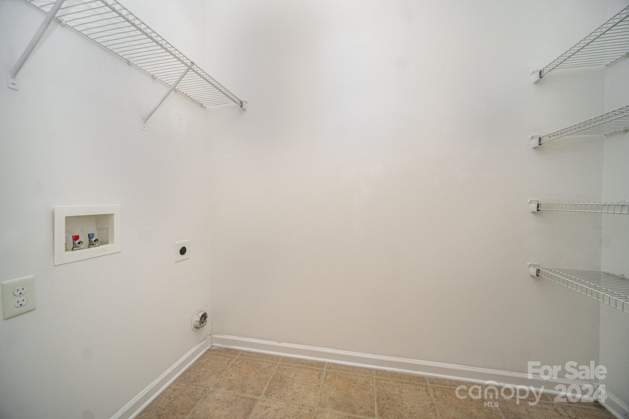 1007 Yellow Bee Road Indian Trail, NC 28079 - Photo 8 of 21 a view of a room with racks on the wall