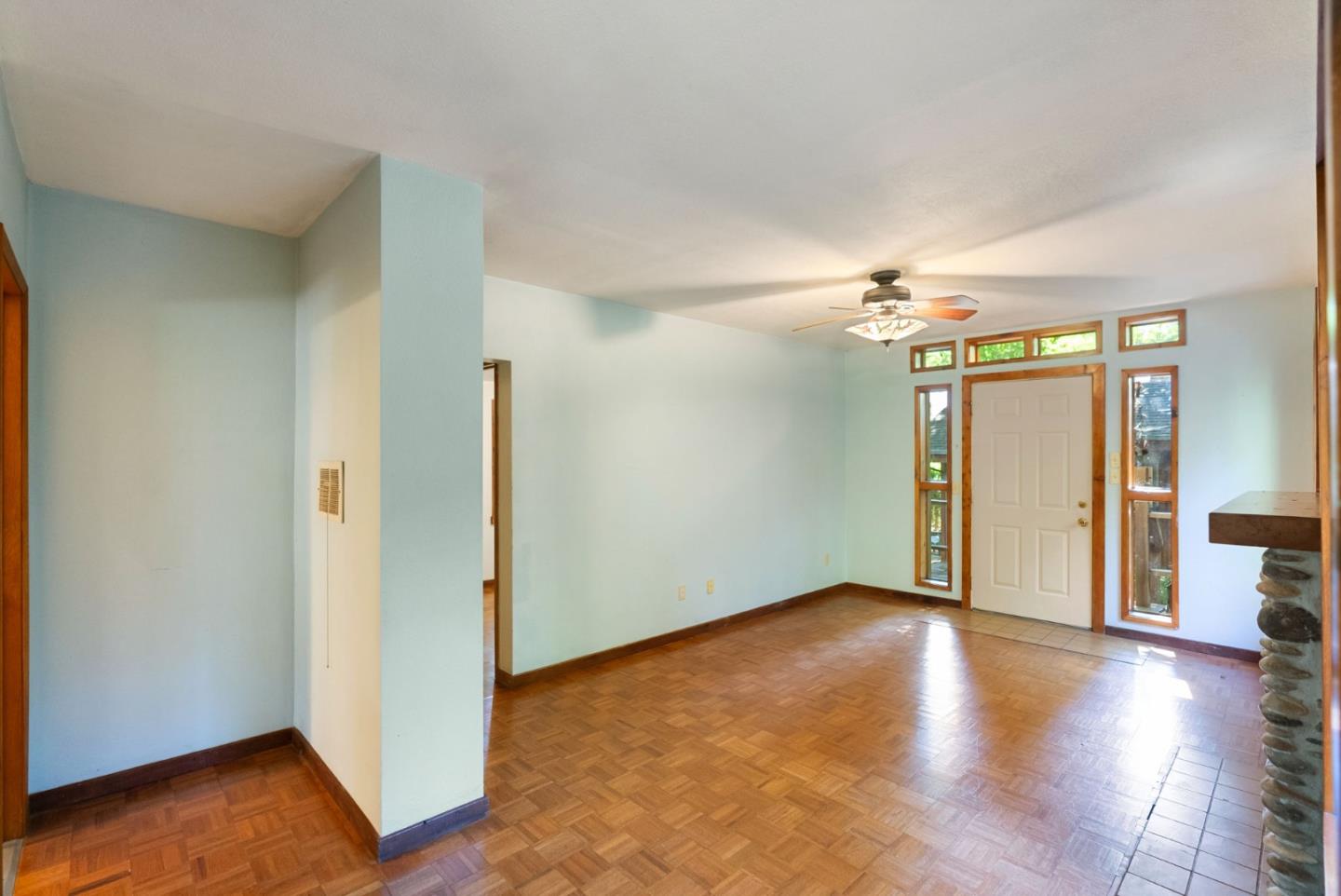 324 Felton Empire Road Felton, CA 95018 - Photo 15 of 43 an empty room with wooden floor and windows
