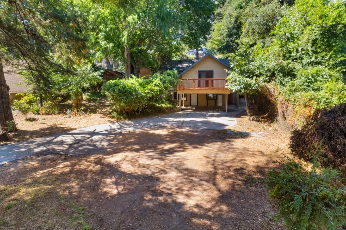 324 Felton Empire Road Felton, CA 95018 - Photo 2 of 43 a front view of a house with a yard and garage
