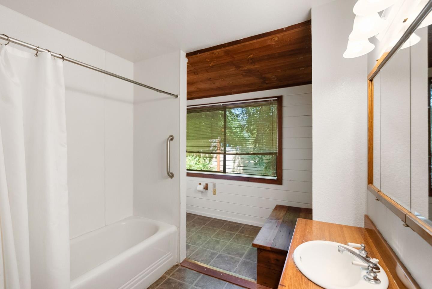 324 Felton Empire Road Felton, CA 95018 - Photo 22 of 43 a bathroom with a toilet and a bathtub