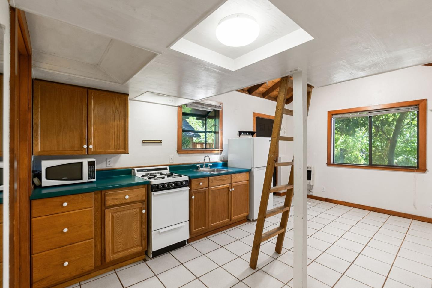 324 Felton Empire Road Felton, CA 95018 - Photo 31 of 43 a kitchen with stainless steel appliances granite countertop a sink and cabinets