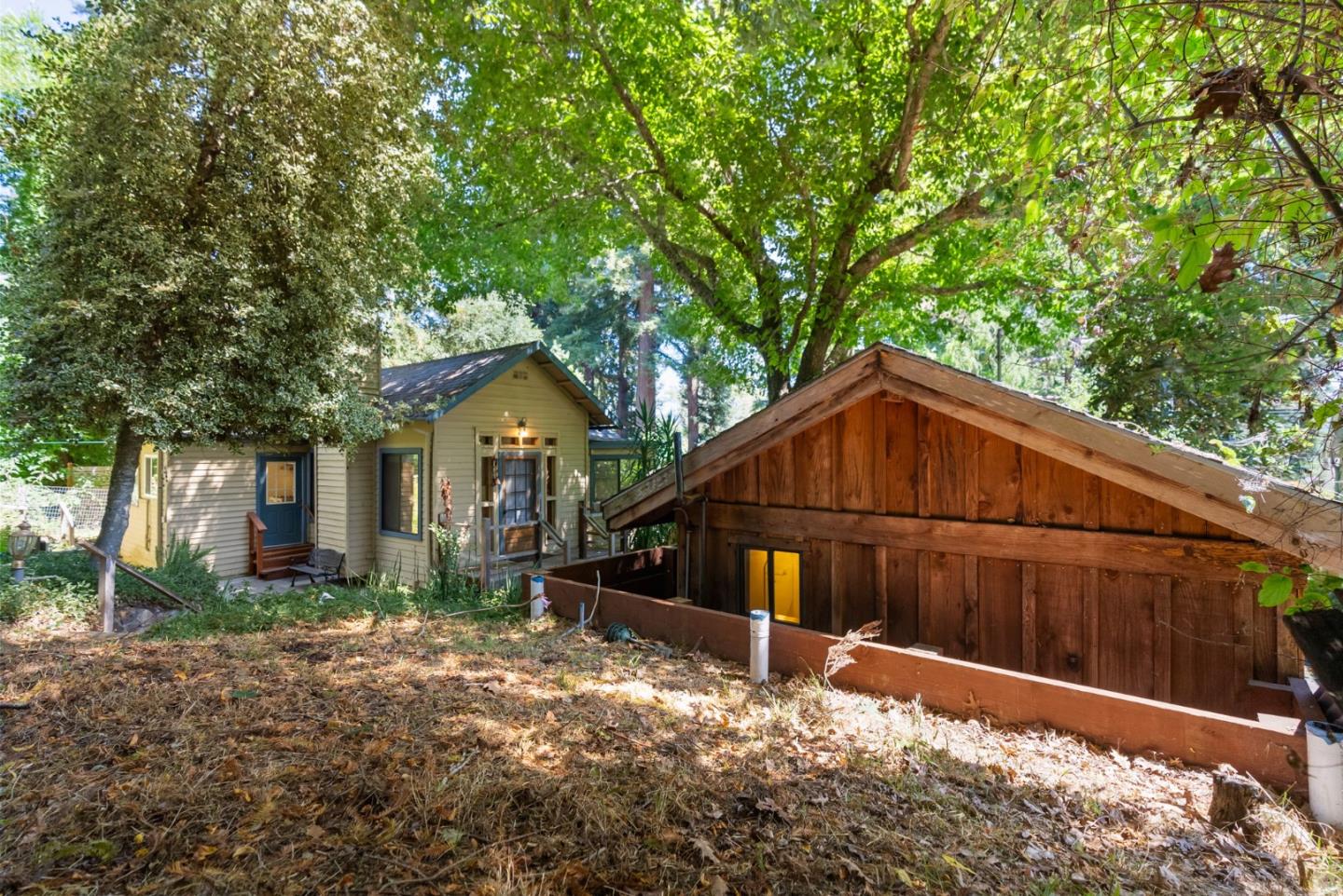 324 Felton Empire Road Felton, CA 95018 - Photo 36 of 43 a view of a small house with wooden fence and large trees