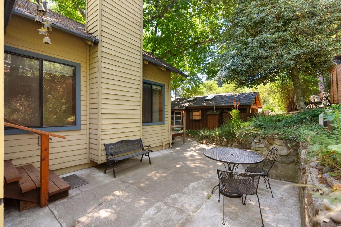 324 Felton Empire Road Felton, CA 95018 - Photo 5 of 43 a view of a patio with table and chairs and potted plants