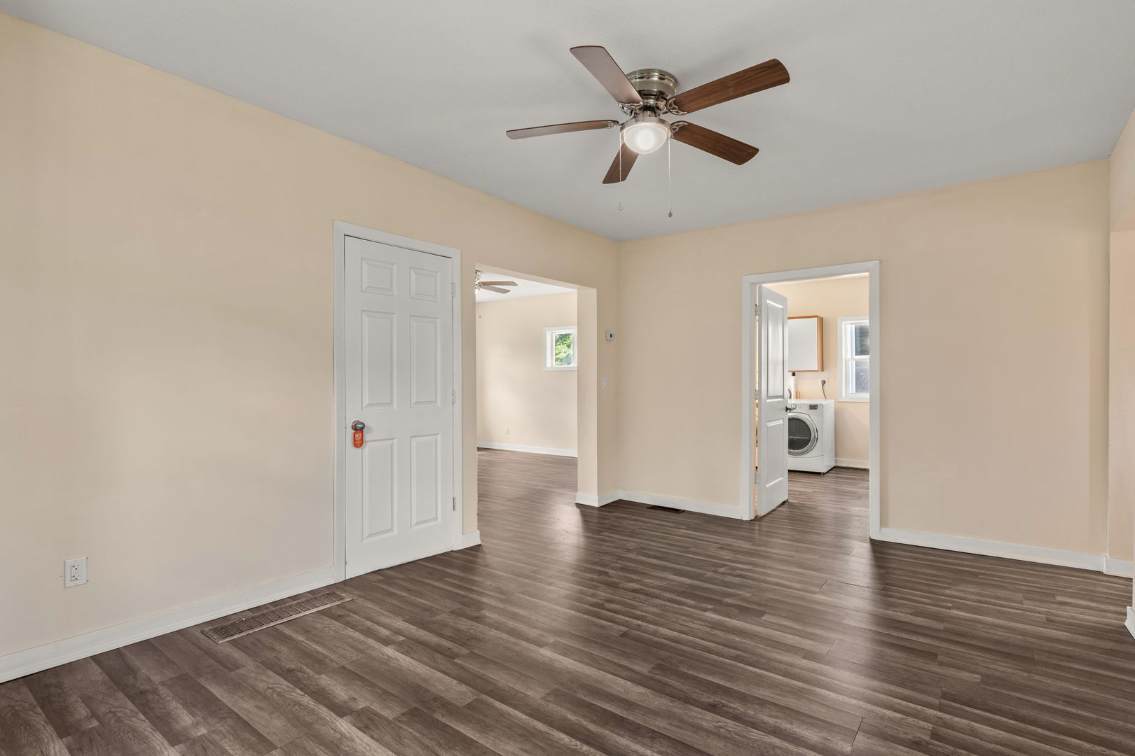548 7th Avenue South Clinton, IA 52732 - Photo 7 of 23 an empty room with wooden floor and a ceiling fan