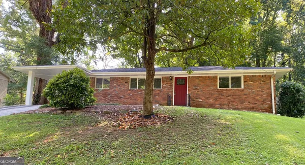 front view of a house with a yard