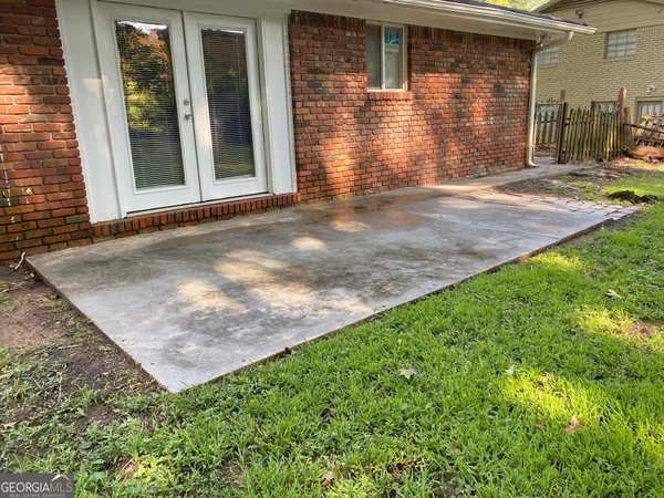 a view of a pathway both side of house