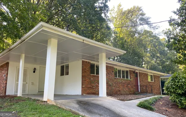 a kitchen with a sink a stove a refrigerator and a window