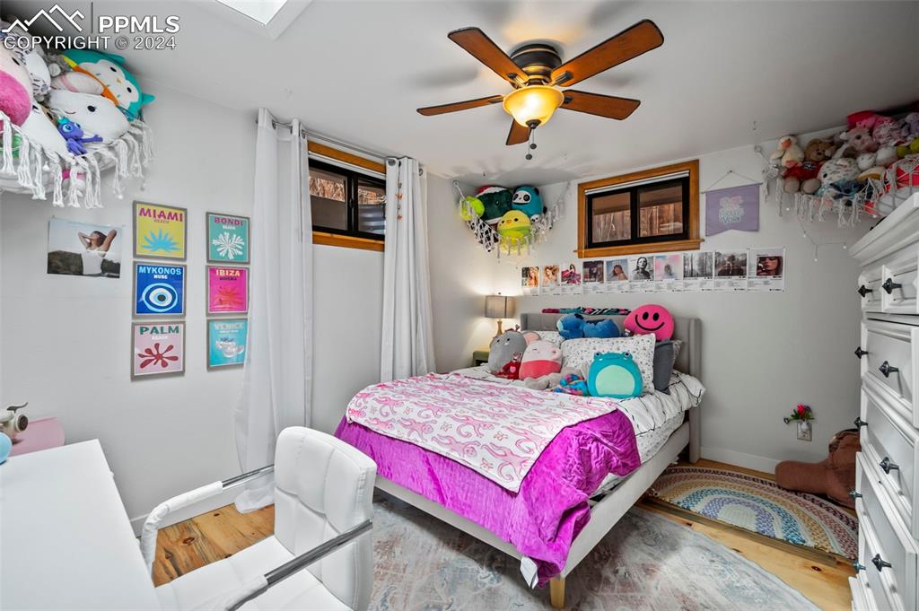 925 High Road Manitou Springs, CO 80829 - Photo 15 of 20 a bedroom with a bed and furniture