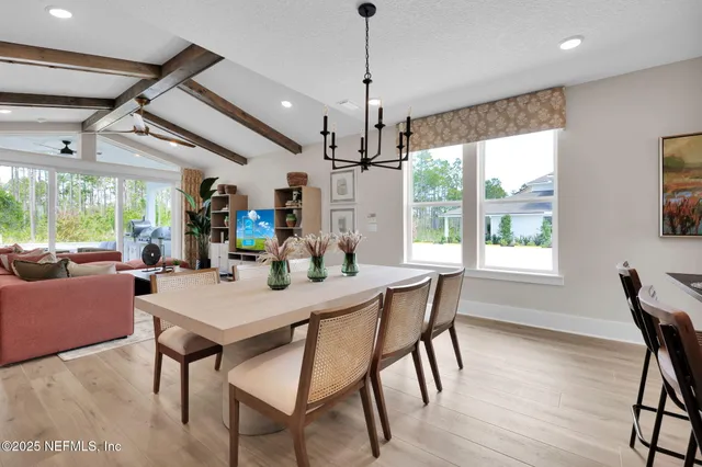 a bedroom with a large bed and a large window