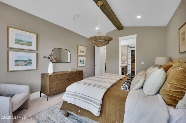 a bedroom with furniture and a window