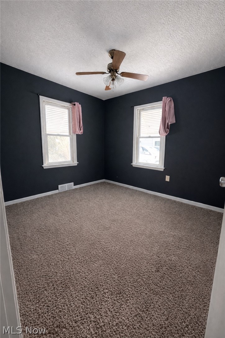 33688 Guilbert Road Eastlake, OH 44095 - Photo 9 of 13 Bedroom featuring a ceiling fan and a textured ceiling