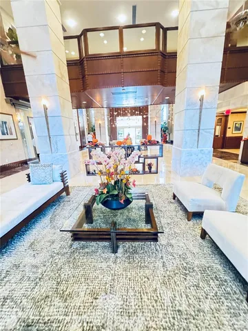 a play room with furniture and a chandelier