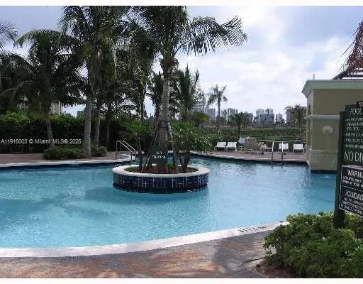 a view of a swimming pool with lounge chair