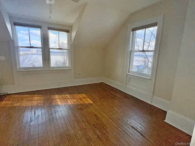 a bathroom with a bathtub and window