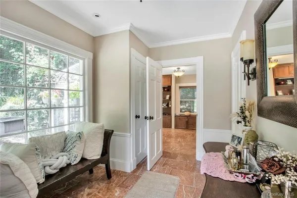 a living room with furniture and a window