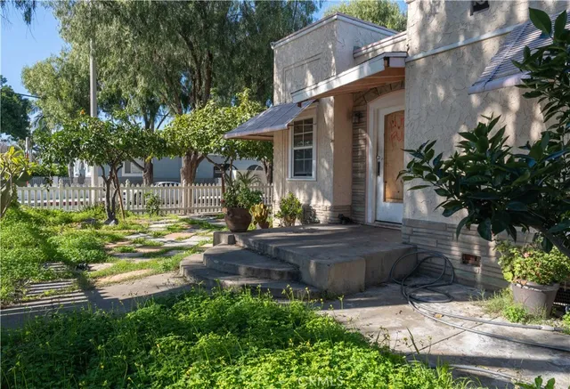 a front view of a house with garden