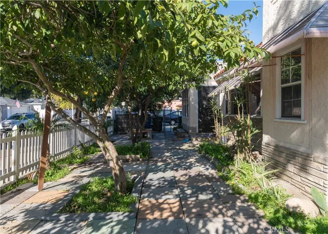 a backyard of a house with outdoor seating