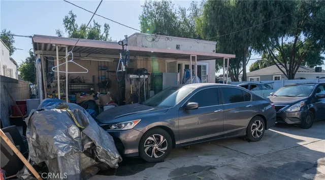 a view of a car parked in front of house