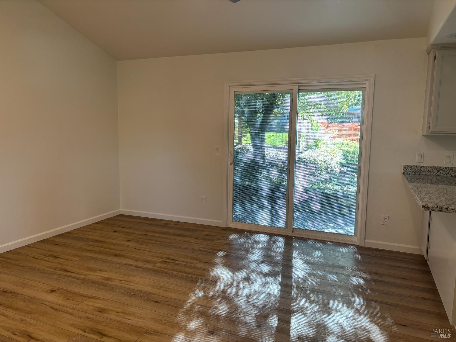 1776 Meda Avenue Santa Rosa, CA 95404 - Photo 14 of 28 a view of an empty room with wooden floor and a window