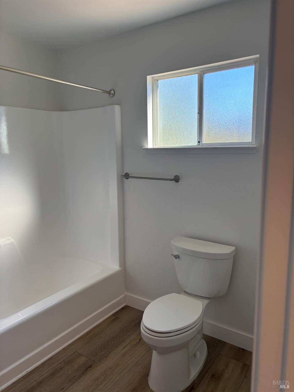 1776 Meda Avenue Santa Rosa, CA 95404 - Photo 24 of 28 a white toilet sitting next to a window