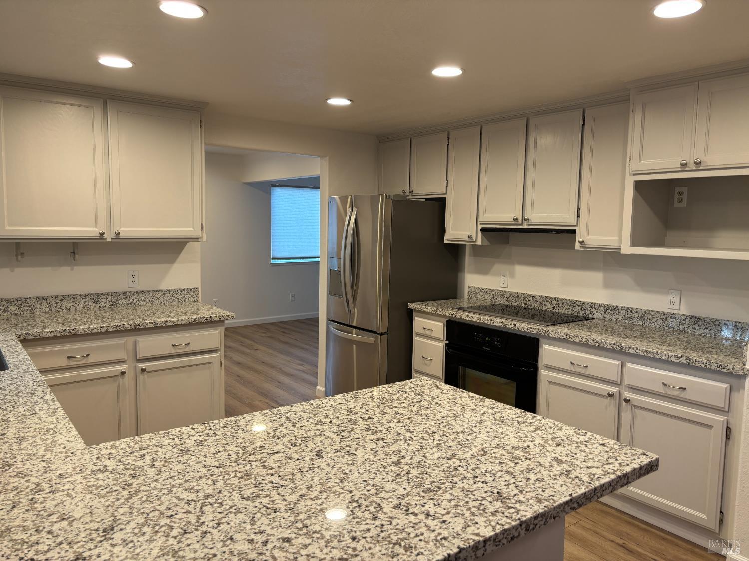 1776 Meda Avenue Santa Rosa, CA 95404 - Photo 10 of 28 a kitchen with a refrigerator sink and cabinets