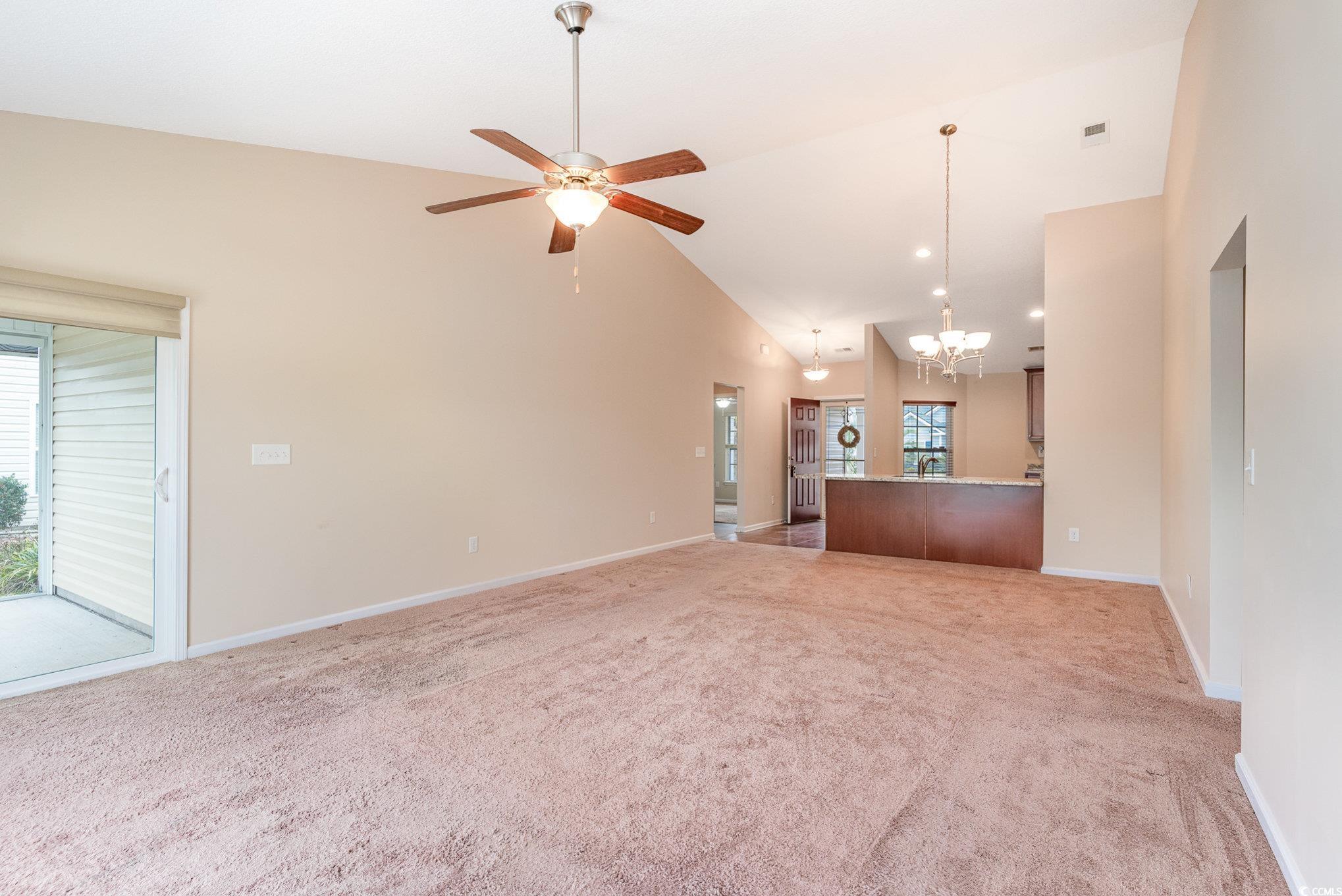 654 Old Castle Loop Myrtle Beach, SC 29579 - Photo 12 of 39 Unfurnished living room featuring carpet floors, h
