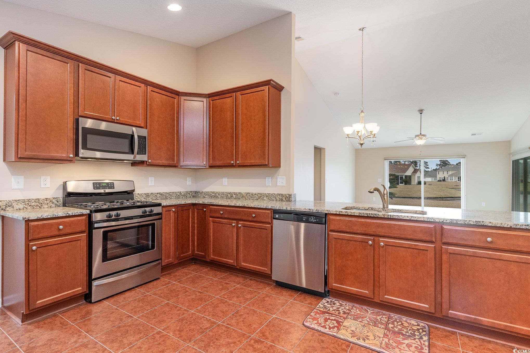 654 Old Castle Loop Myrtle Beach, SC 29579 - Photo 8 of 39 Kitchen with stainless steel appliances, a sink, l